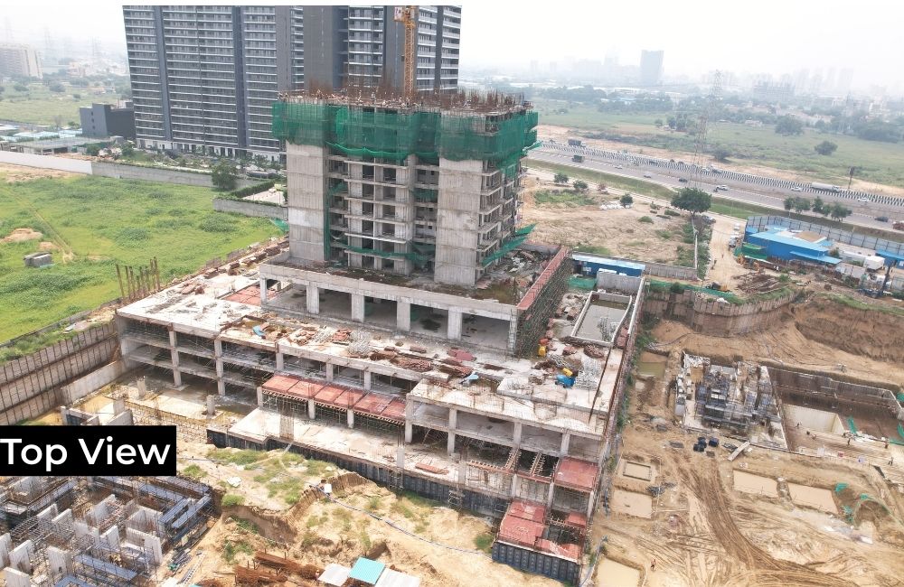 top-down view of an active construction site for a large building.