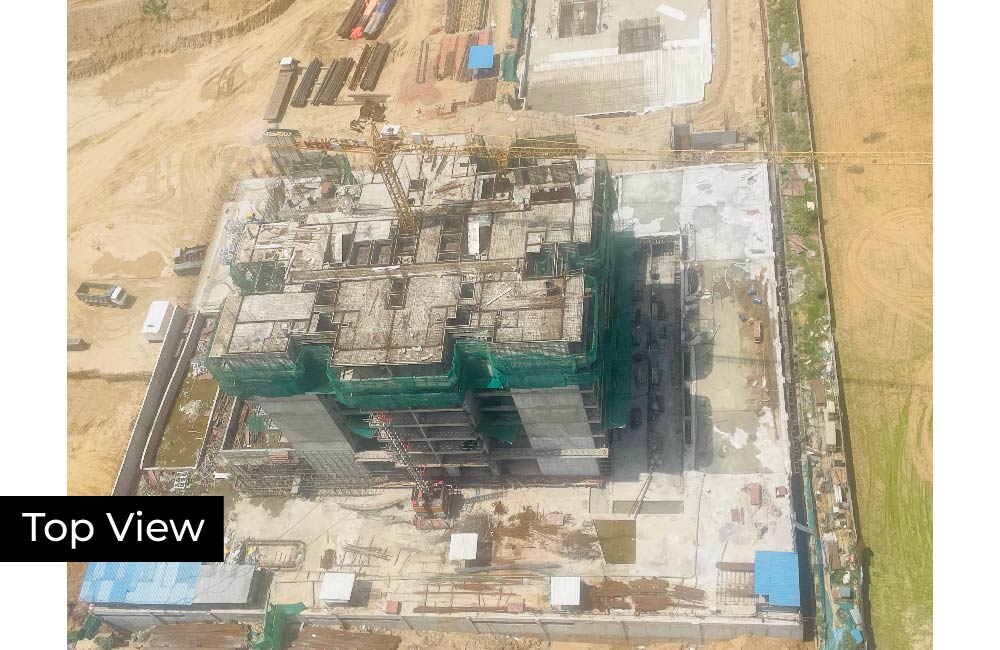 Construction update showing the completed concrete structure of the new tower.