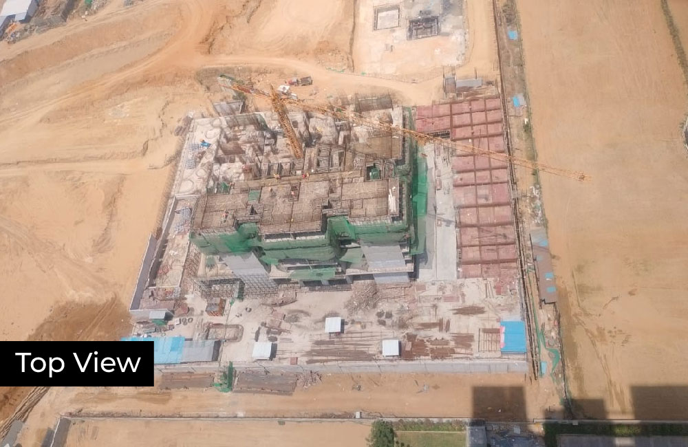 Progress showing facade panel installation on the lower floors.